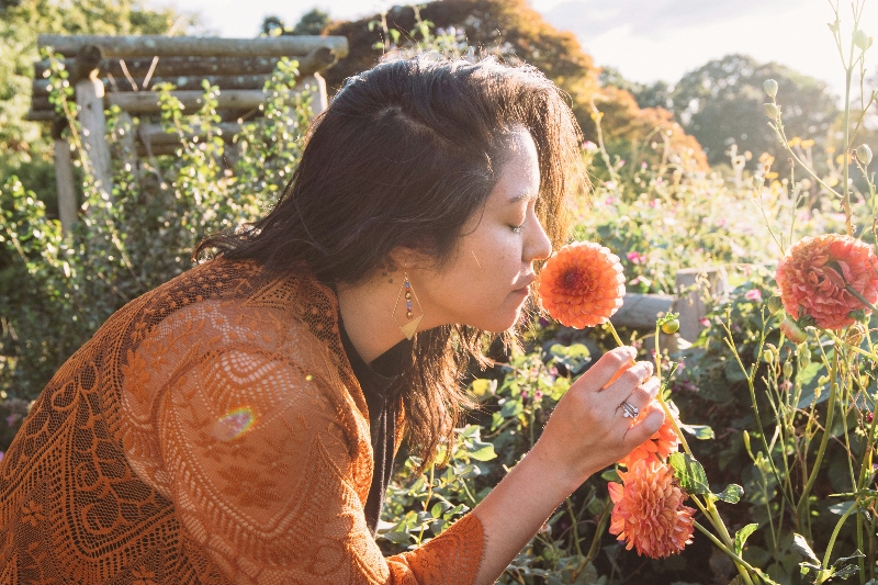 Lara amongst dahlias in golden light